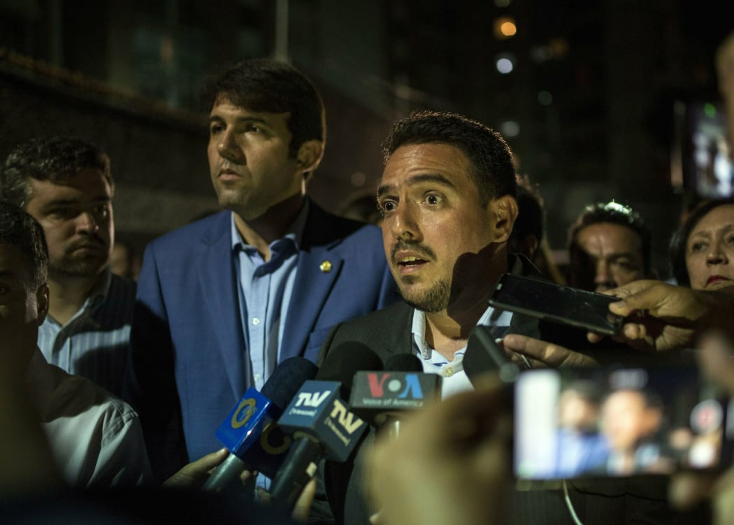 Opposition Deputy of the National Assembly Stalin Gonzalez talks to journalists at the Democratic Action political party headquarters in Caracas, Venezuela, Wednesday, May 8, 2019, after National Assembly Vice President Edgar Zambrano was arrested
