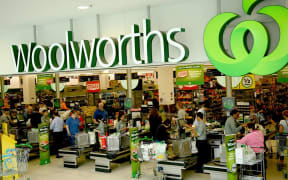 People shop at a Woolworths supermarket in Sydney.