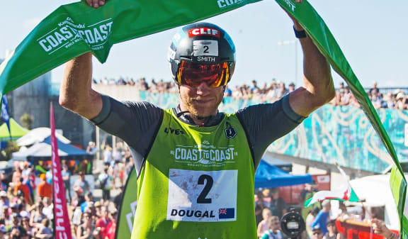 Dougal Allan crosses the finish line to win the Elite category. Kathmandu Coast To Coast. New Brighton, Christchurch 9th February 2019.
Copyright photo: Craig Morrison / www.photosport.nz
