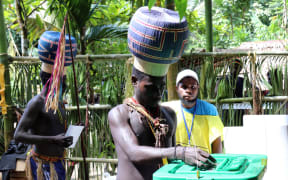 Young Upe men casting their votes in the Bougainville Referendum.