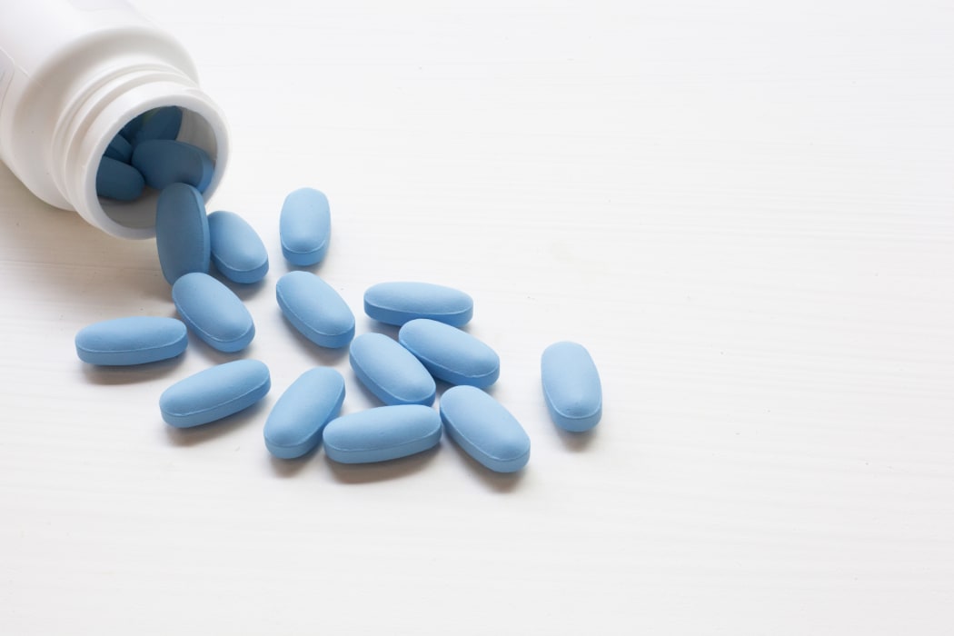 A bottle of "PrEP" ( Pre-Exposure Prophylaxis). used to prevent HIV, on white background.