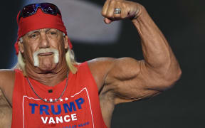 US pro-wrestler Hulk Hogan flexes his muscles after speaking at a 2024 Republican National Convention.