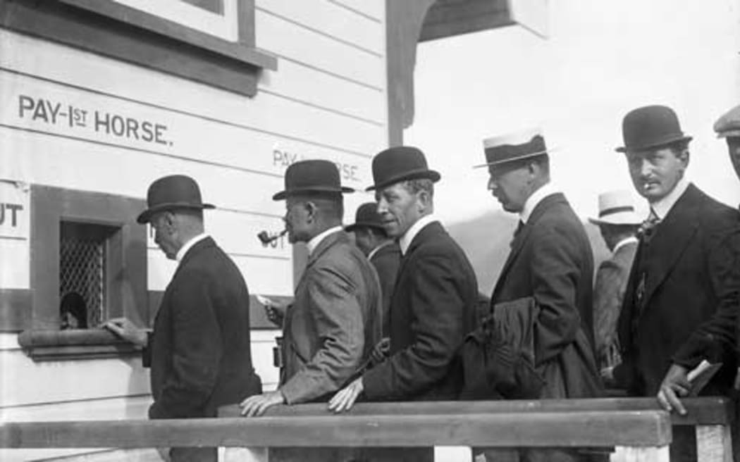 Men queue to place their bets at Trentham racecourse 1912