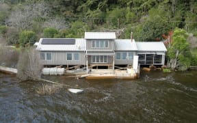 The level of Lake Rotoehu has risen to a point where lakeside homes, including the Blairs', are being flooded. Photo / Andrew Warner