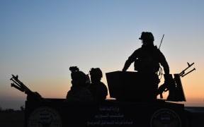 The strikes were in retaliation for a rocket attack on an Iraqi base in Kirkuk where Iraqi soldiers are pictured here.