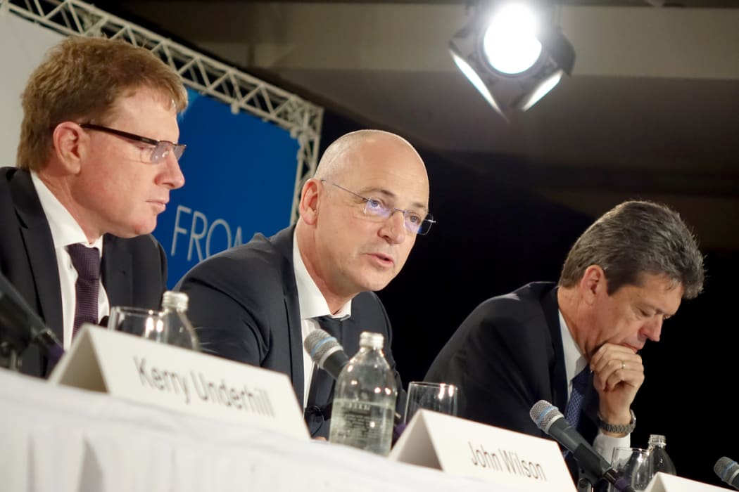 Fonterra chief executive Theo Spierings announces a large profit fall with chairman John Wilson, left, and chief financial officer Lukas Paravicini, right.