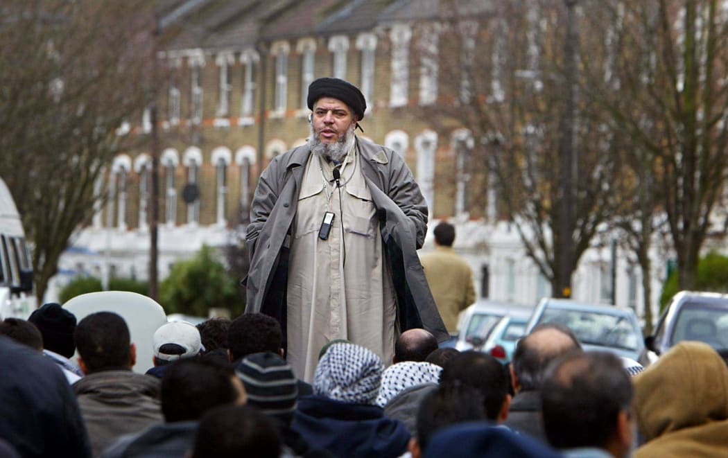 Abu Hamza al-Masri addresses followers during Friday prayer near Finsbury Park in north London on 26 March 2004.