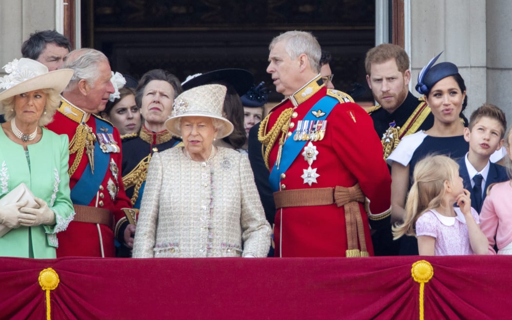 Queen Elizabeth II, Prince Charles, Camilla, Duchess of Cornwall, Princess Anne, Prince Andrew, Prince Harry and Meghan, Duchess of Sussex at the balcony of Buckingham Palace in June.
