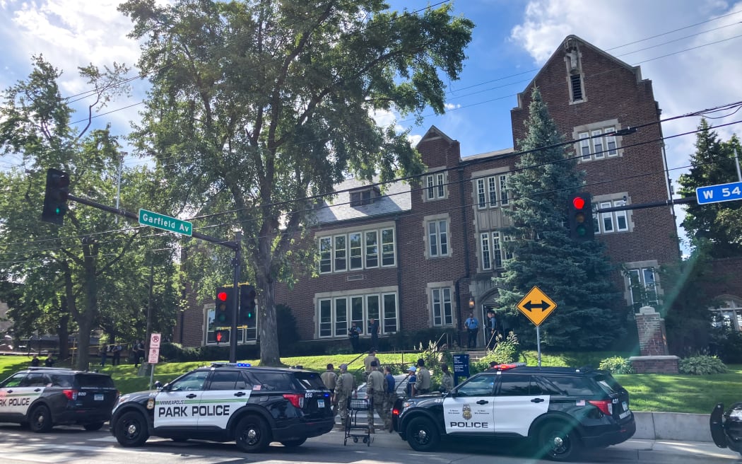 Police and first responders work at the scene of a shooting near Annunciation Church and Catholic School in Minneapolis, Minneosta, on 27 August, 2025.