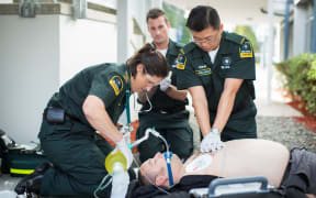 St John Ambulance paramedics performing CPR