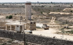 Egyptian guards patrol the border with Gaza at military checkpoints. This photo was taken from the Gaza strip border town of Rafah.