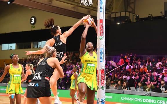 Jamaica's Jhaniele Fowler scores against New Zealand's Karin Burger during their bronze medal play-off in the Netball World Cup in Cape Town on 06 August 2023.