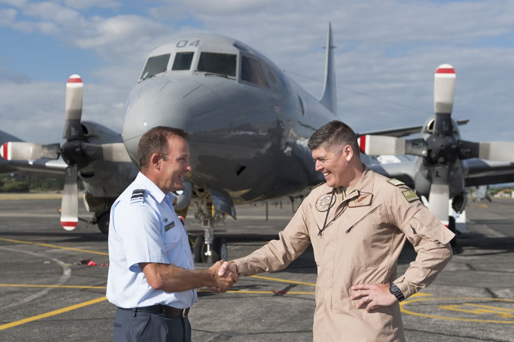 Air Vice-Marshal Tony Davies (left), the Chief of Air Force, farewells Wing Commander Daniel Hunt, who will lead the maritime security operations in the Middle East.