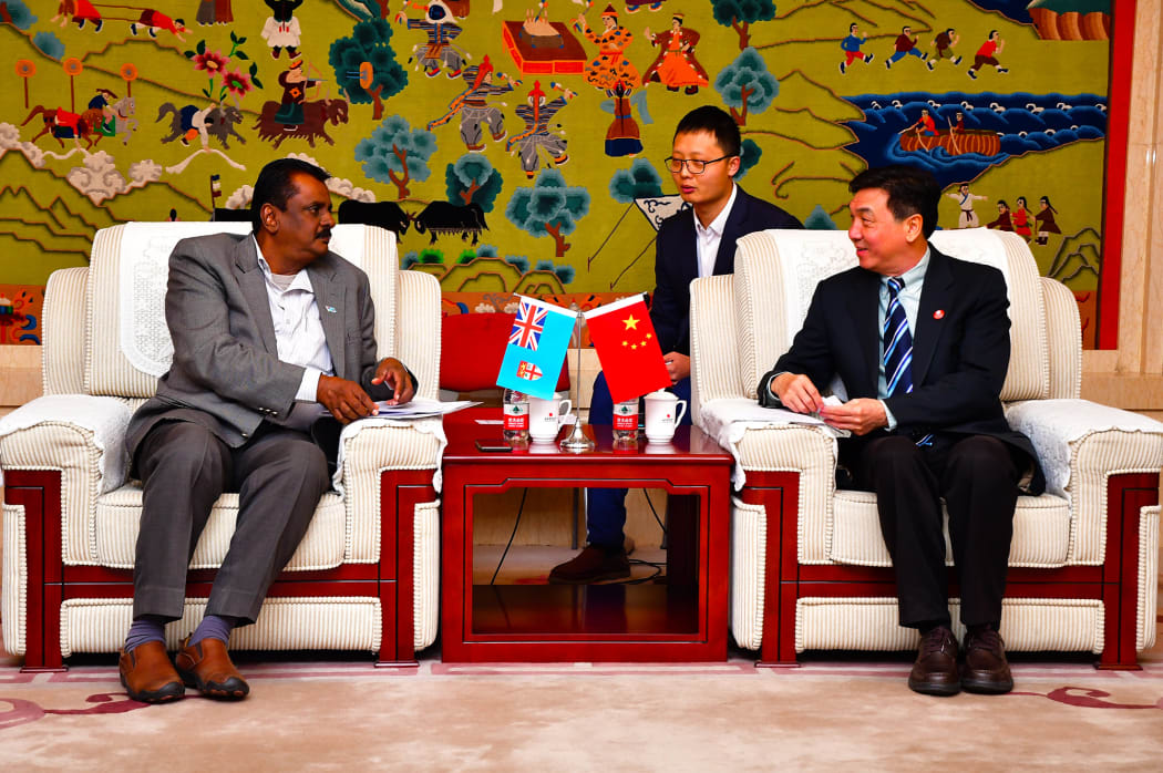 The vice president of the Beijing Sports University, Lunhao Xia (Right front) meets with Fiji's sports minister Parveen Kumar.