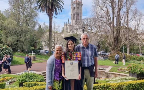 Roi with her parents, Takeua and Greg, at graduation