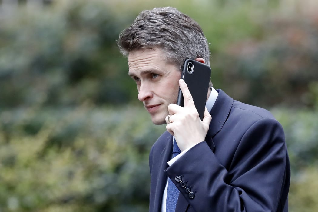 File photo of Britain's Defence Secretary Gavin Williamson speaking on a mobile phone as he arrives at 10 Downing Street. He's been sacked over the leak of details of a plan to use Huawei to build the UK's 5G network.