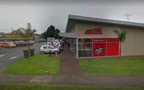 A woman was stabbed outside the Bairds Road Pizza Hut.