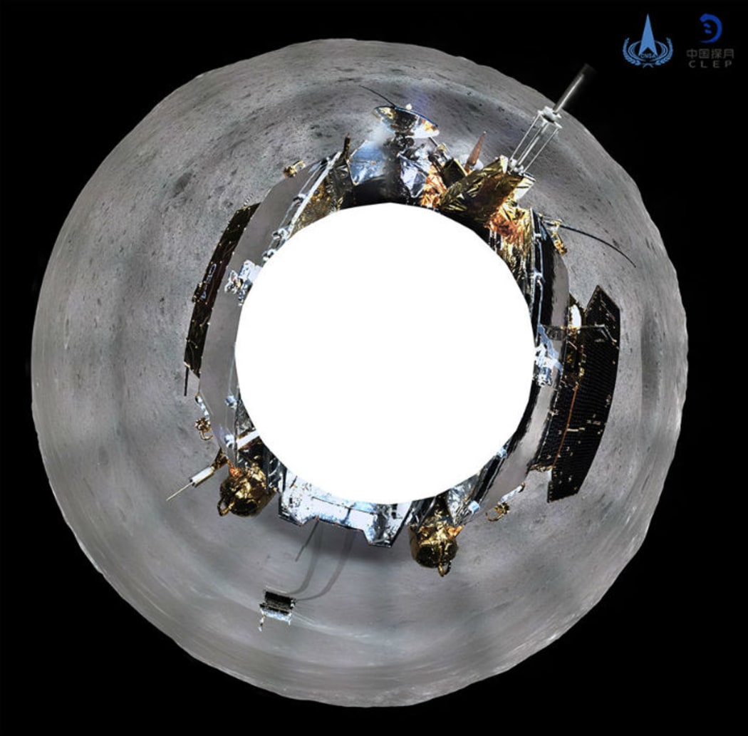 A 360-degree photo shows the grey moonscape, the lander and the rover. Chinese National Space Administration.