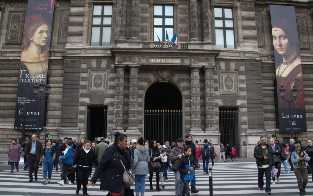Posters for the exhibition 'Leonardo da Vinci' are seen on the facade of The Louvre Museum in Paris on October 24, 2019, on the day of the exhibition's opening.