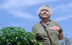 Australian Shirley Shackleton, wife of late Australian journalist Greg Shackleton, stands by the grave in Jakarta on July 9, 2010, where five journalists, the so-called Balibo Five, who were killed in East Timor in 1975, were buried.