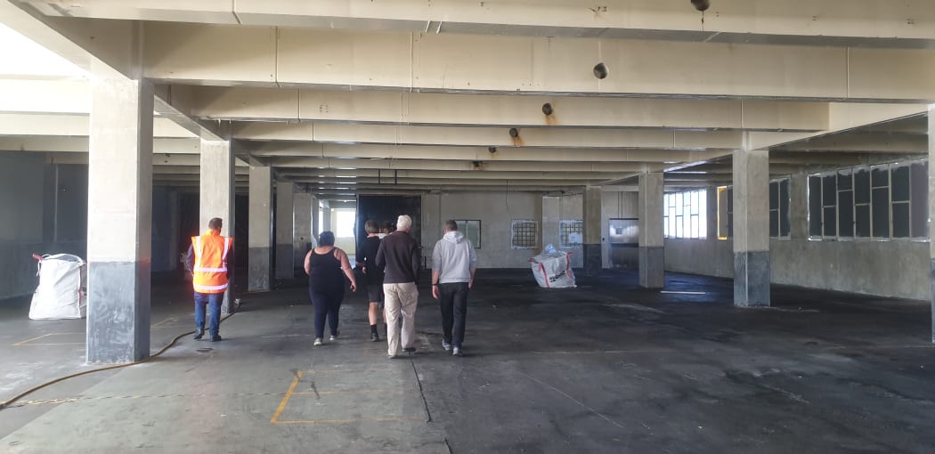 Former staff walk through the Cadbury factory