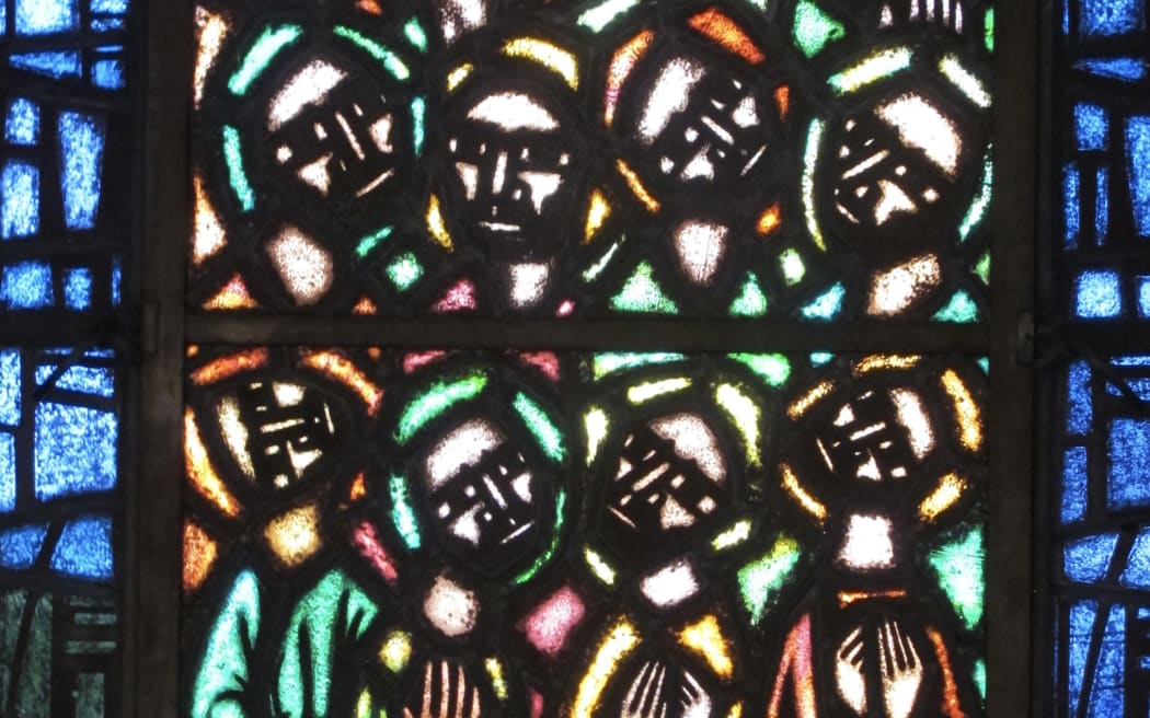 Stained glass images of male faces