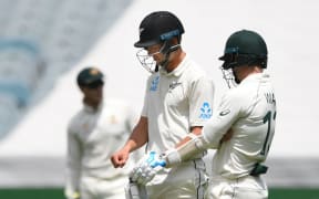 Trent Boult checks his hand.