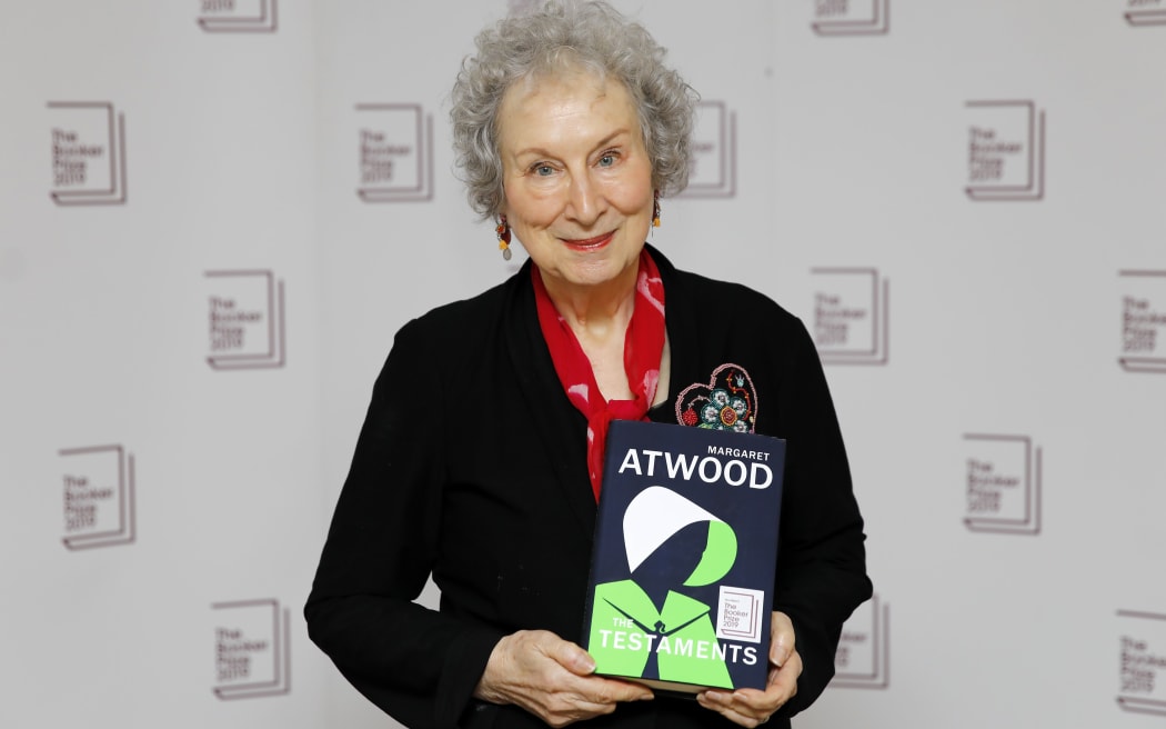 Canadian author Margaret Atwood poses with her book 'The Testaments' that won her the 2019 Booker Prize for Fiction
