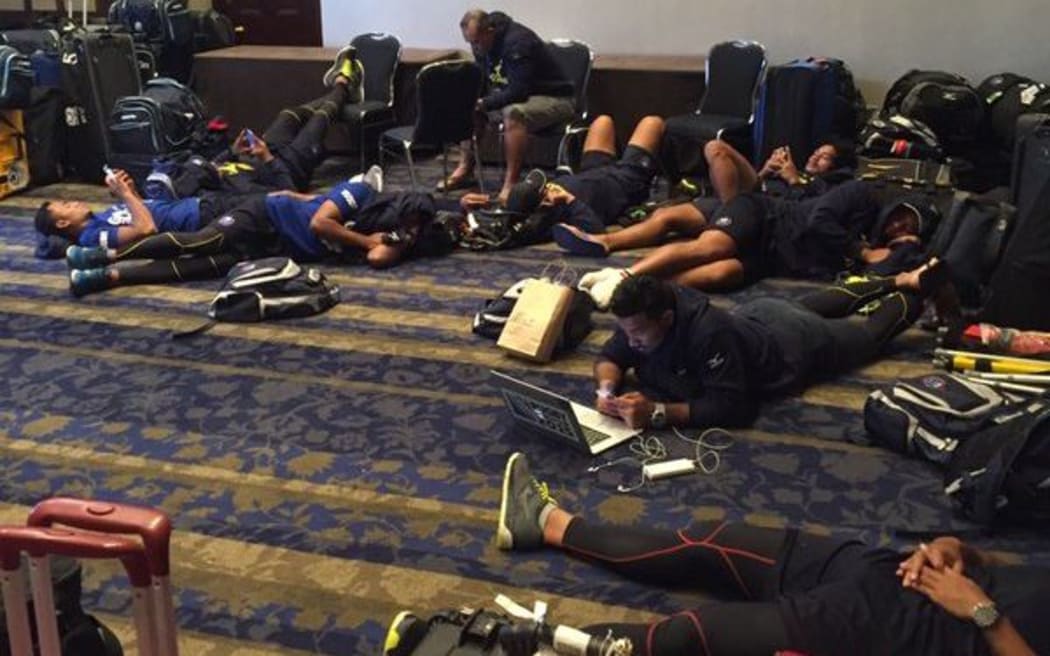 The Samoa sevens team tries to get comfortable in their hotel lobby.