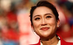 (FILES) Thai candidates for prime minister Paetongtarn Shinawatra, known by her nickname "Ung Ing" and the youngest daughter of former prime minister Thaksin Shinawatra, looks on during an election rally for Thailand's main opposition Pheu Thai party at the Thunder Dome Stadium in Nonthaburi, north of the capital Bangkok, on April 5, 2023. Thailand's Pheu Thai party chose Paetongtarn Shinawatra, the daughter of billionaire ex-PM Thaksin, as its candidate for prime minister, it said August 15, 2024, a day after a court dismissed the incumbent premier in an ethics case. (Photo by Jack TAYLOR / AFP)