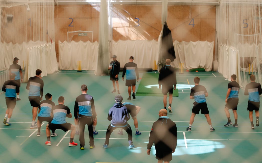 Black Caps players stretching and warming up in the indoor nets