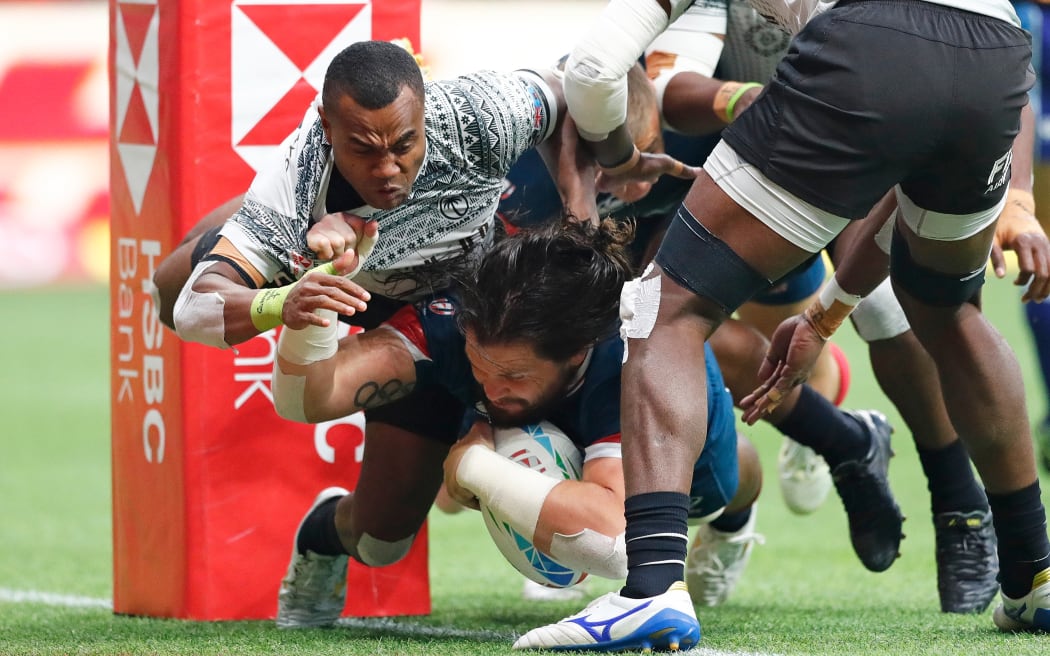 USA's Danny Barrett scores a try against Fiji in Vancouver.