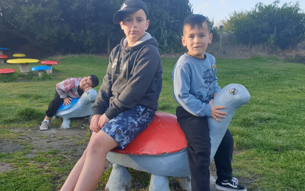 Rear: Rocko, left front Eligh and Bentley Nicholls ride the Tahunanui turtles. On holiday in Nelson from Levin.