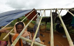 Rohingya refugees build a new makeshift shelters in the refugee camp of Thyangkhali near the Bangladeshi village of Gumdhum, on September 18, 2017. More than 400,000 Rohingya Muslims have now arrived in Bangladesh from their Buddhist do
