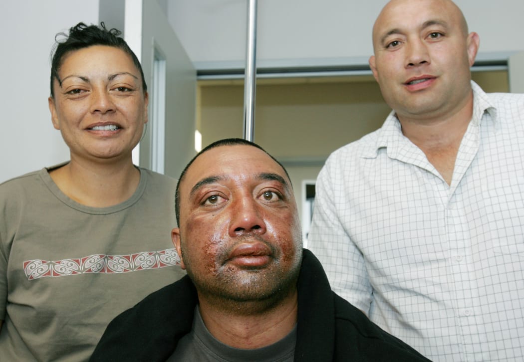 Rob Hewitt, centre, the day after his sea ordeal ended on February 8, 2006, pictured with fiancee Rangi Ngatai and brother Norm Hewitt.