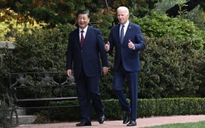 US President Joe Biden and Chinese President Xi Jinping walk together after a meeting during the Asia-Pacific Economic Cooperation (APEC) Leaders' week in Woodside, California on November 15, 2023.