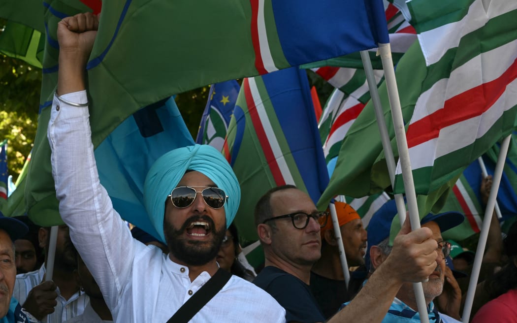 Members of the Indian community protest along with unions of agriculture workers on June 25, 2024 in Latina, near Rome. The protest was organised by the Lazio Indian Community Association for Satnam Singh, the 31-year-old labourer abandoned in front of his house by his employer after losing his right arm in an accident on a farm in Borgo Santa Maria.