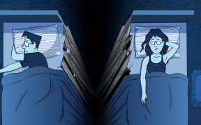 An illustration of a couple separated by a cliff in a bed.