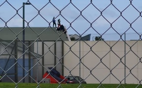 Young people on the roof at Korowai Manaaki Youth Justice Residence in Wiri, Auckland, 2 July 2023.