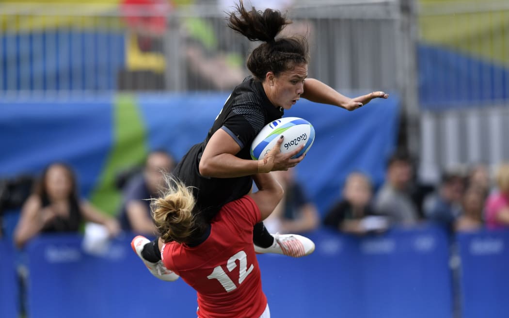Ruby Tui is tackled by Great Britain's Amy Wilson Hardy in the semi-final.