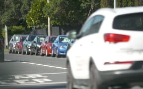 Cars parked on an Auckland road.