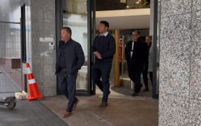 All Blacks and Blues winger Caleb Clarke leaves court before he makes a statement to media.