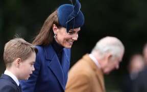 Catherine, Princess of Wales and Prince George of Wales (left) leave after attending the Royal Family's traditional Christmas Day service at St Mary Magdalene Church on the Sandringham Estate in eastern England, on 25 December, 2023.