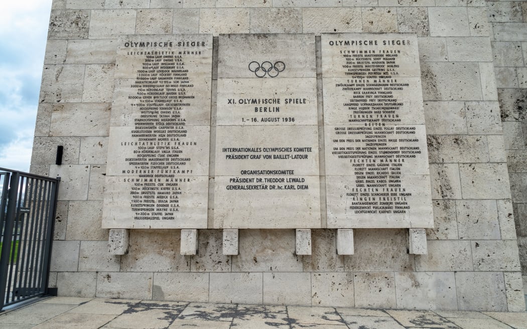 Plates with the winners of the Olympic games in 1936 at the Olympic Stadium in Berlin. Includes Jack Lovelock of New Zealand.