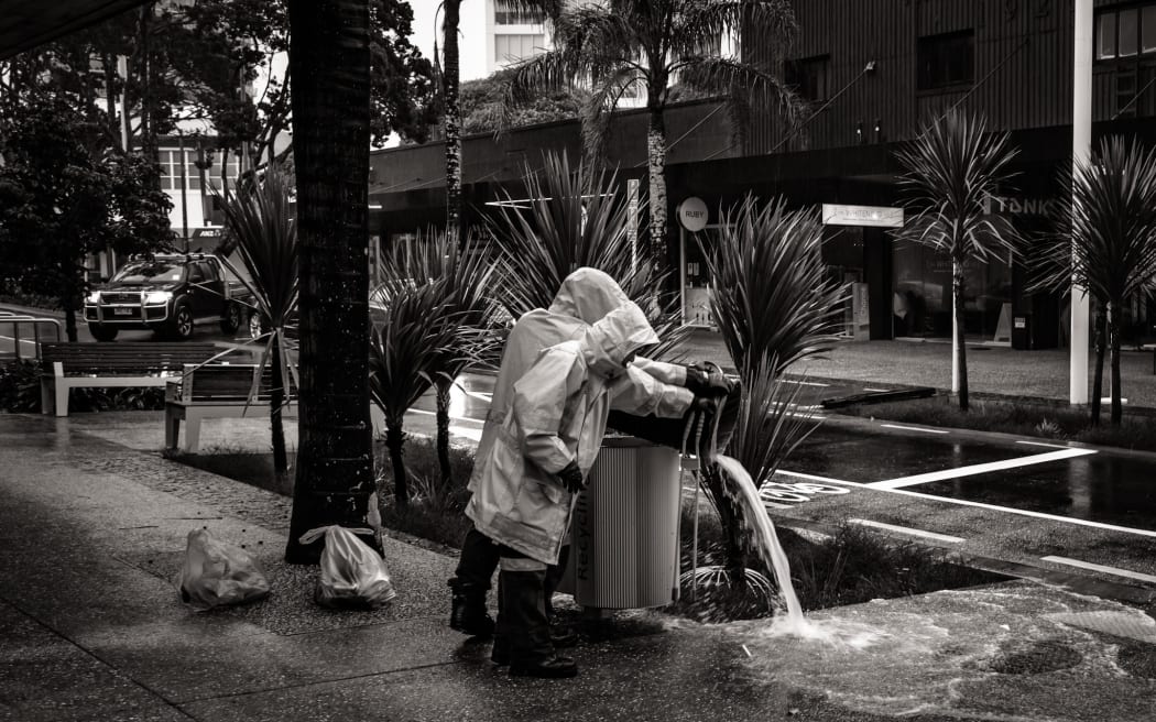 Bins filled up with water after heavy rain on Nile Road, Milford, North Shore, Auckland.