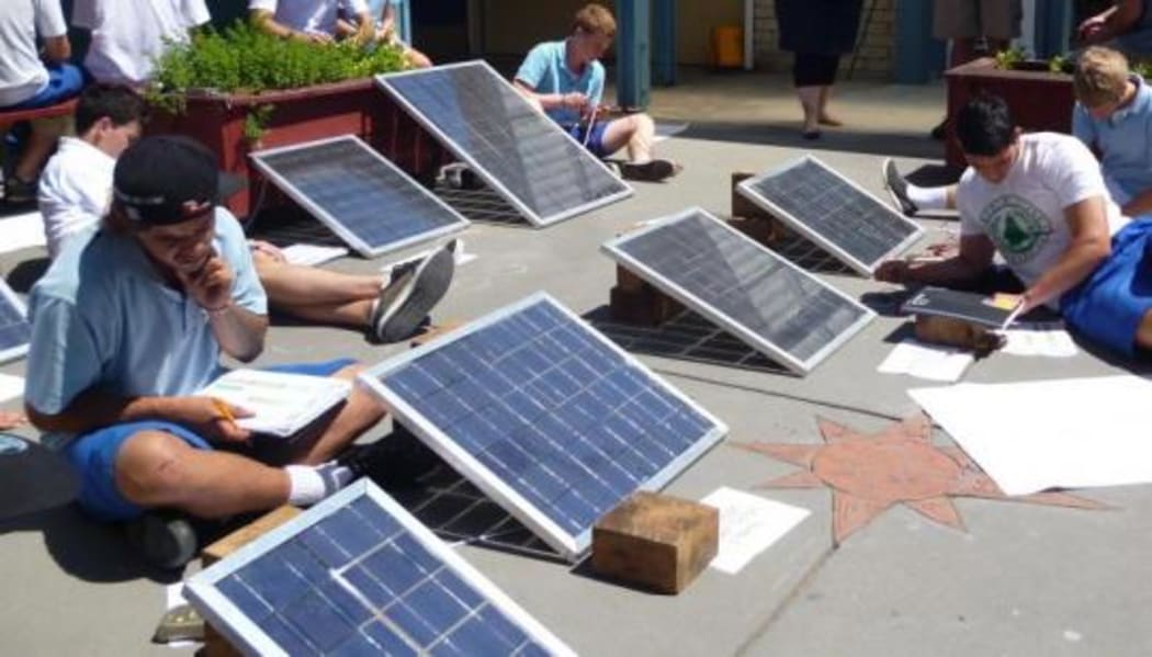 Students from Trident High School testing their photo voltaic water heating systems