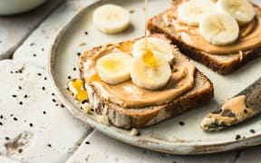 Peanut butter, banana and honey on toast.