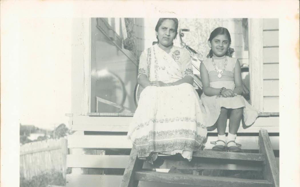 Dahi and her daughter Indira sit outside their home in Eltham, Taranaki.