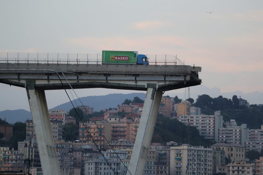 A lorry stands on the edge of the collapsed Morandi motorway bridge in the northwestern city of Genoa.