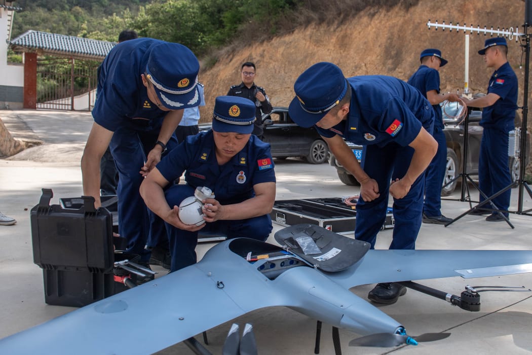 A drone is prepared to monitor the migrating wild Asian elephants in Eshan County, Yuxi City, southwest China's Yunnan Province.